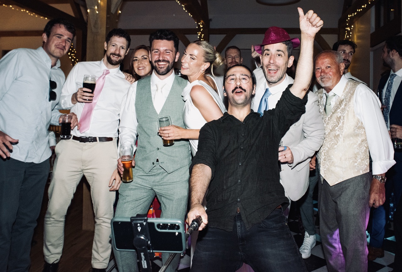 Wedding Band singer Joe in the audience singing funk